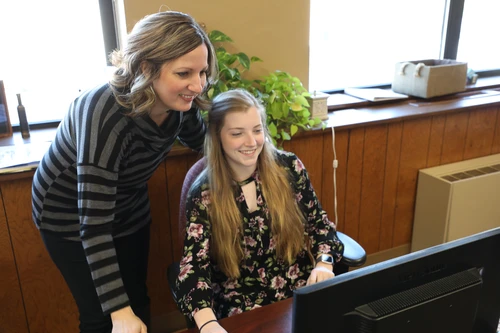 Staff helping students